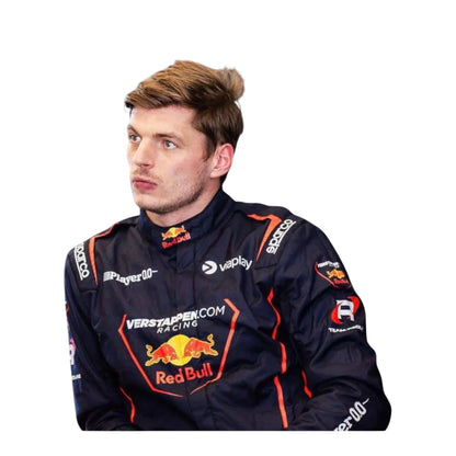 Max Verstappen British team Red Bull wearing a racing suit with Red Bull and Verstappen.com branding, standing against a plain white background.”