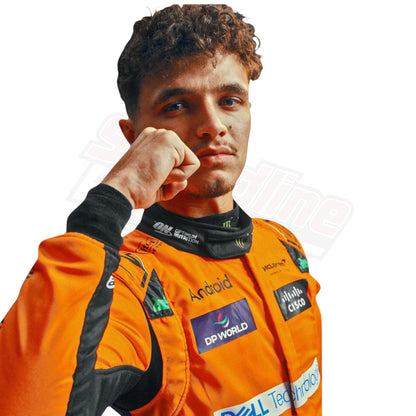 Racer dressed in an orange racing suit featuring multiple sponsor logos, standing on a plain white background.